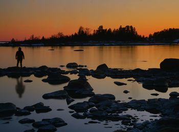 Scenic view of lake against sky during sunset