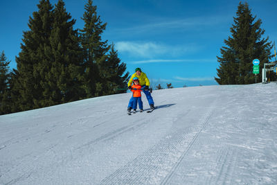 Man skiing on snow covered landscape