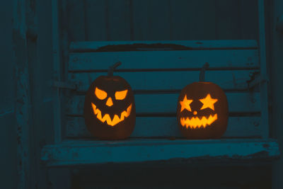 View of illuminated pumpkin on wall at night