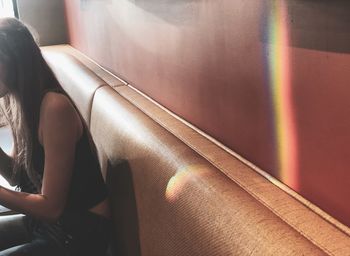 High angle view of woman sitting on chair