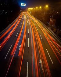 Blurred motion of train on road at night