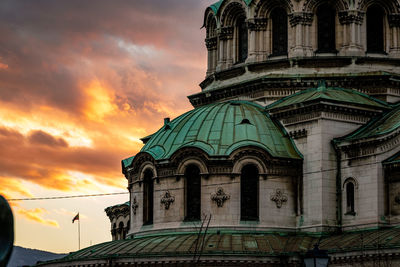 Low angle view of building against sky during sunset