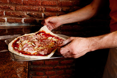 Midsection of man preparing food