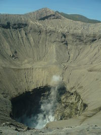 Smoke emitting from bromo,  volcanic mountain