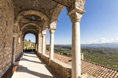 View of colonnade against sky