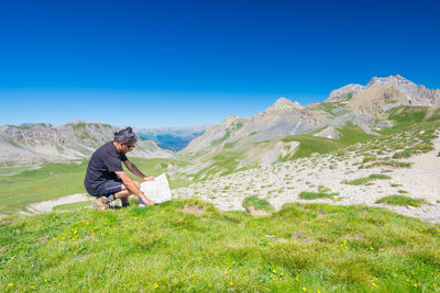 Man on mountain against sky