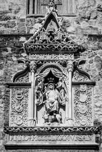 Low angle view of statue against building