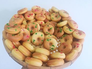 Close-up of multi colored candies against white background