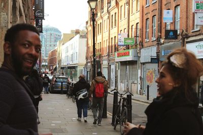 Man and woman on street in city