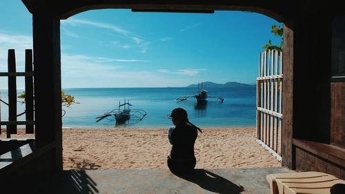 People on beach against sky