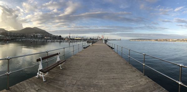 Pier over sea against sky