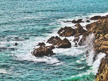 Waves splashing on rocks