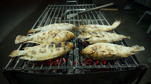 High angle view of meat on barbecue grill