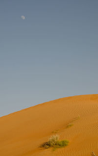 Scenic view of desert against clear sky