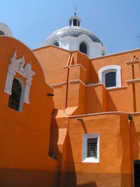 Low angle view of bell tower against sky