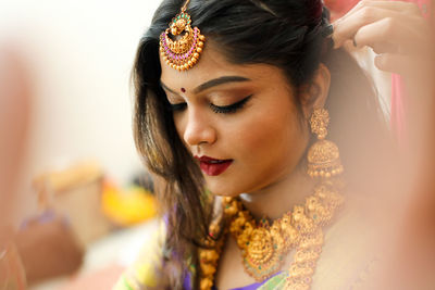 Close-up of an indian bride getting ready for her big day