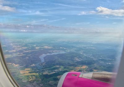Aerial view of landscape seen through airplane window