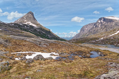 Scenic view of mountains and lake against sky