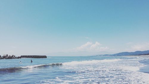 Scenic view of sea against blue sky