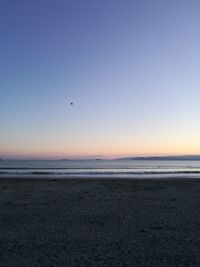 Scenic view of sea against clear sky during sunset