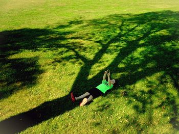 Woman standing on grassy field