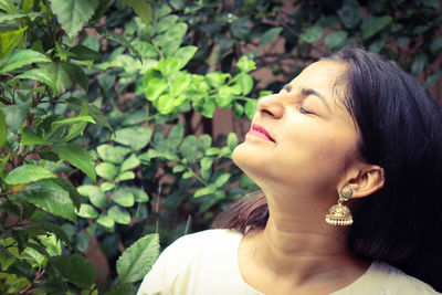 Portrait of young woman with eyes closed