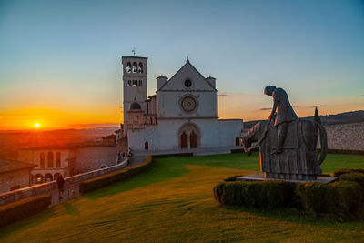 Scenic view of saint francis basilica in assisi, umbria, italy, at sunset