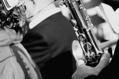 Cropped image of musician playing wind instrument