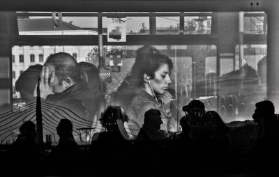 Multiple exposure image of people sitting at cafe