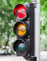 Close-up of road sign, traffic lamp