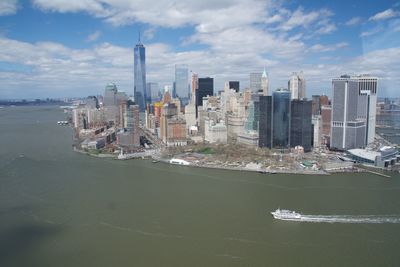 High angle view of east river by modern buildings in city