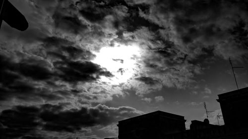 Low angle view of building against cloudy sky