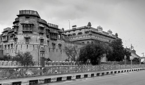 View of buildings against cloudy sky