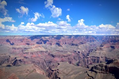 Scenic view of dramatic landscape against cloudy sky