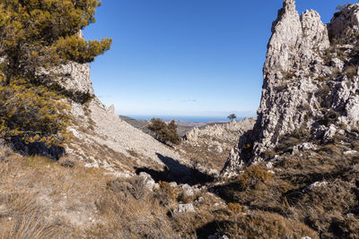 Mountainous landscape on a sunny and cloudy morning.