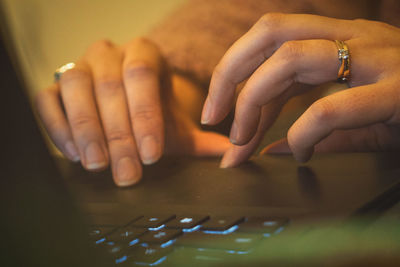Close-up of woman hand on laptop 