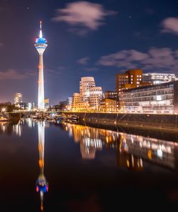 Illuminated buildings in city at night