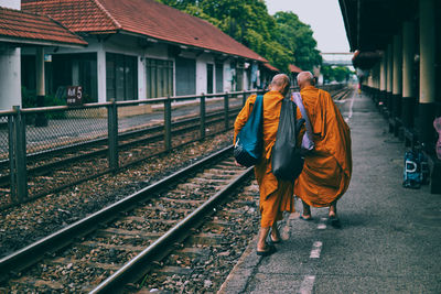 People waiting at railroad station