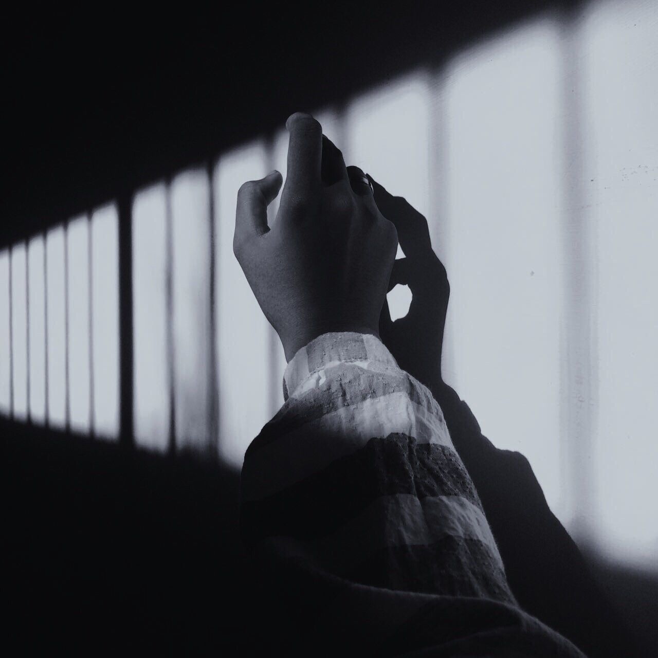 CLOSE-UP LOW SECTION OF MAN AT HOME AT DUSK