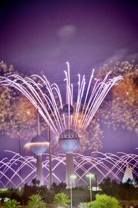 Illuminated ferris wheel at night