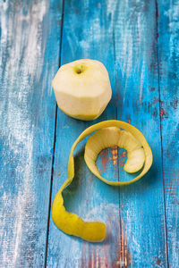 Close-up of peeled apple on table