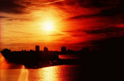 Silhouette of city at sunset