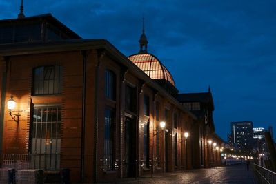 Illuminated buildings in city at night