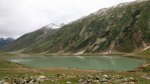 Scenic view of lake and mountains against sky