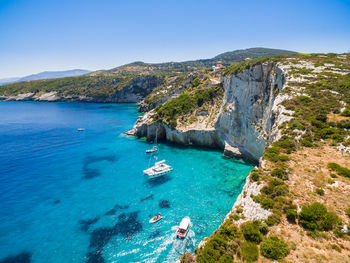 High angle view of bay against clear blue sky