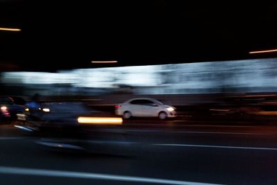 Blurred motion of cars on road at night