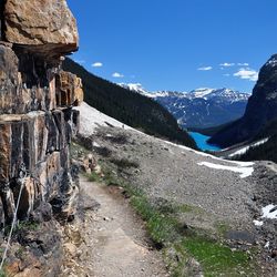 Scenic view of mountain range against blue sky