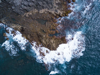 Close-up of cave in sea