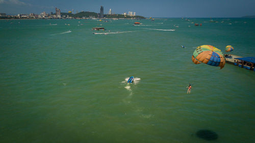 High angle view of people swimming in sea