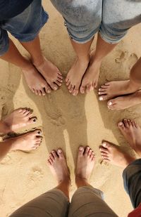 Low section of people standing at beach